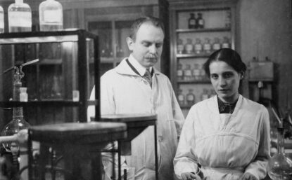 Black and white photo of man and woman in a lab