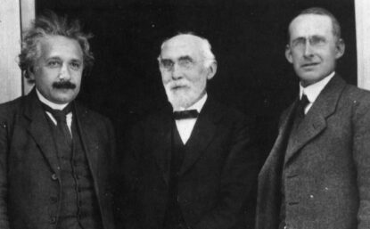 Albert Einstein, Hendrik Lorentz and Arthur Eddington standing outdoors